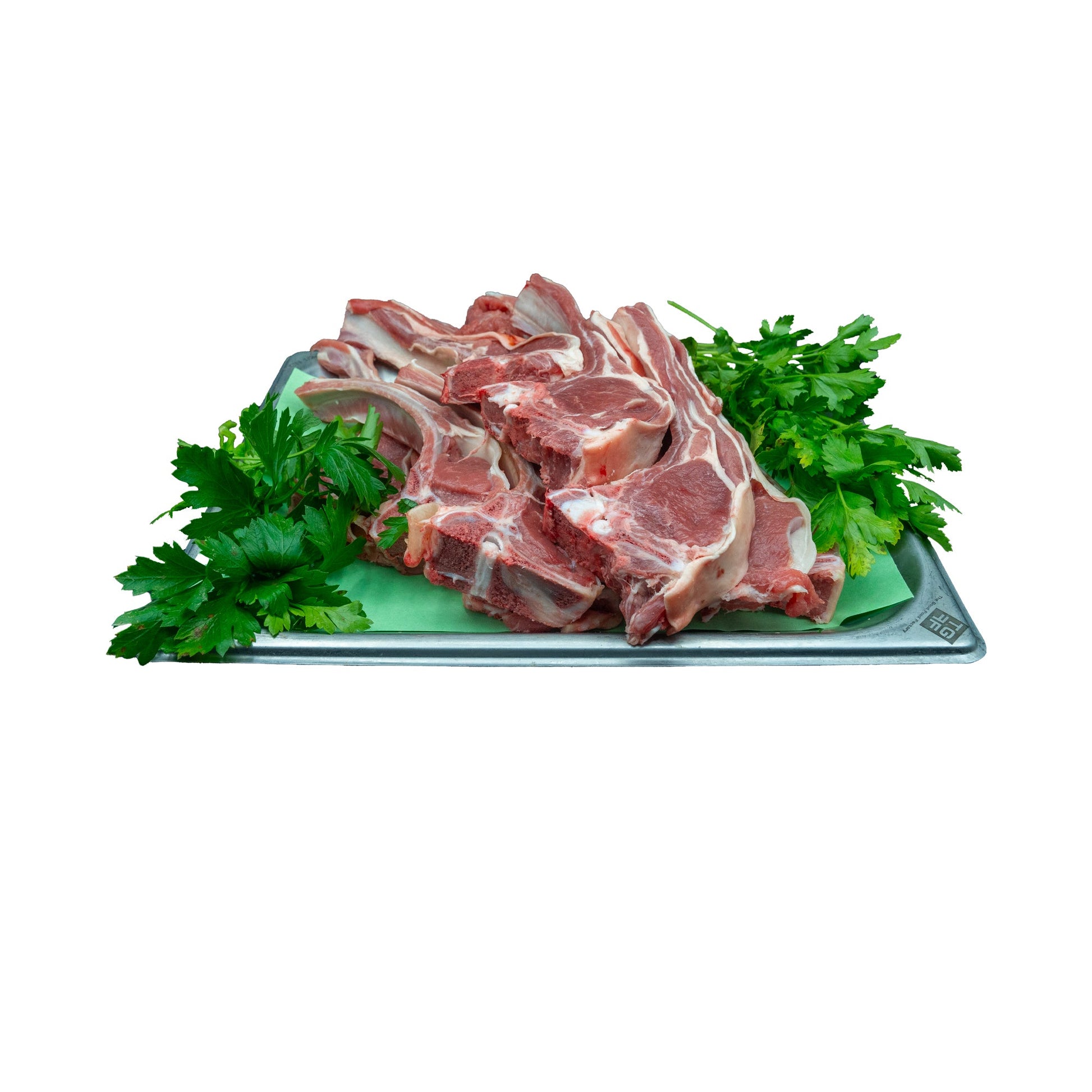 Plateau de côtelettes d'agneau avec garniture de persil frais